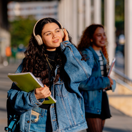 Young Teenage Girl Carrying Books