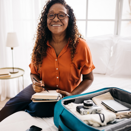 Older Lady Packing For A Holiday