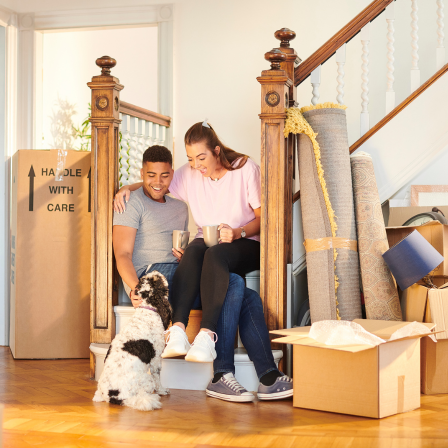 Couple With Dog Moving Into Home
