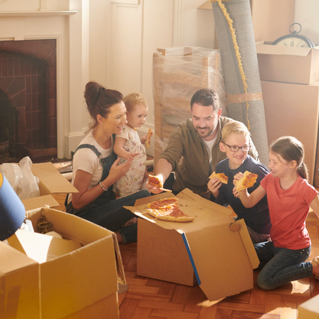 Happy Family Unpacking Boxes