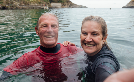 Couple Swimming On Holiday