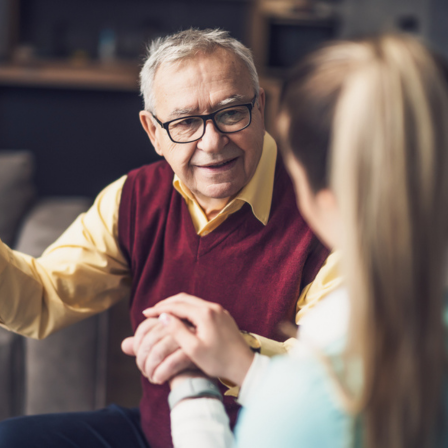Older Man Being Reassured By Woman