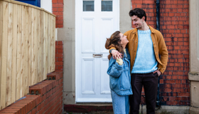 Young Couple Outside New House