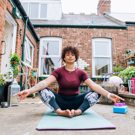 Lady Doing Yoga In Her Garden