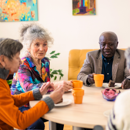A Group Of Older People Talking