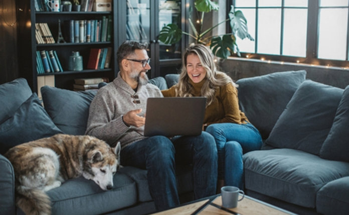 Couple On Sofa With Dog Landscape