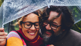 Couple Hugging Under Umbrella Landscape