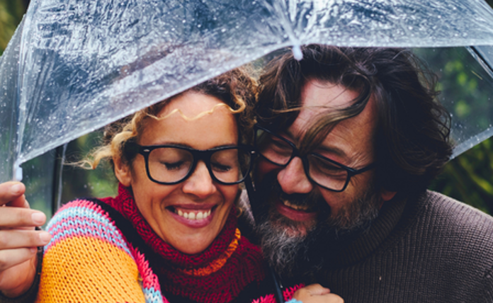 Couple Hugging Under Umbrella Landscape