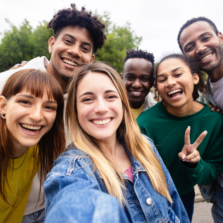 A group of young adults posing for a photo