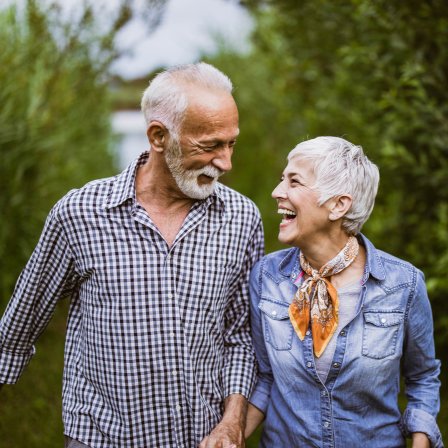 Mature Couple Laughing On Walk