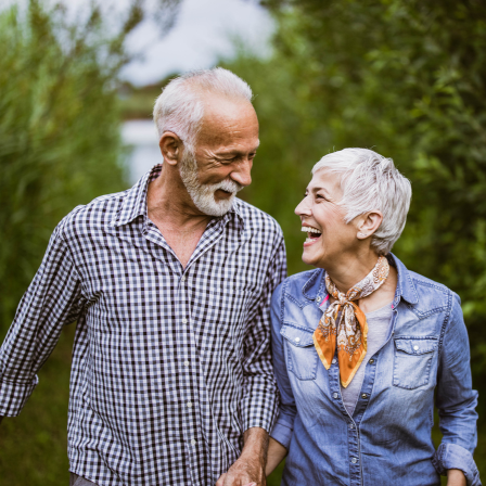 Mature Couple Laughing On Walk