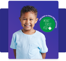 Smiling little boy with Mini First Aid logo