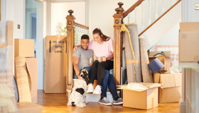 Couple With Dog Moving Into Home Landscape