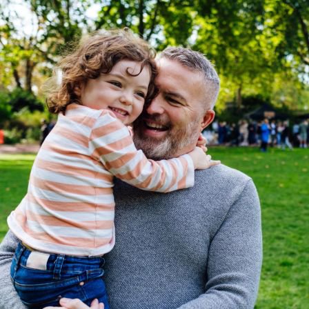 Father Holding Young Daughter