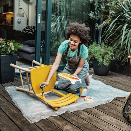 Young Lady Upcycling Furniture