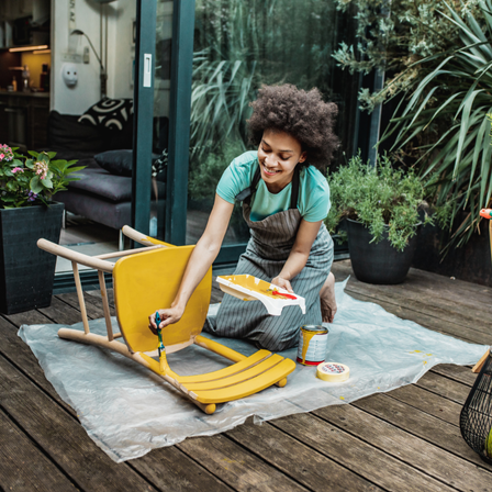 Young Lady Upcycling Furniture