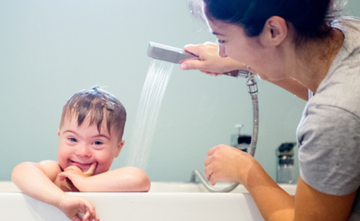 Little boy in the bath with mum