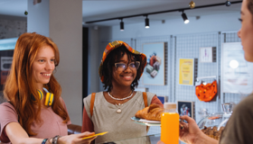 Teenagers buying pastries from a bakery