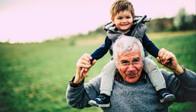 Grandad Carrying Grandson Landscape