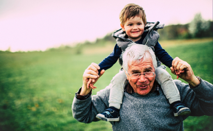 Grandad Carrying Grandson Landscape