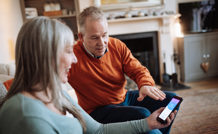 Older couple looking at phone landscape