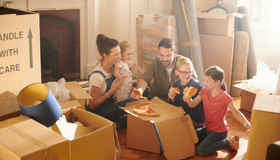 Happy Family Unpacking Boxes