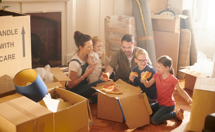 Happy Family Unpacking Boxes