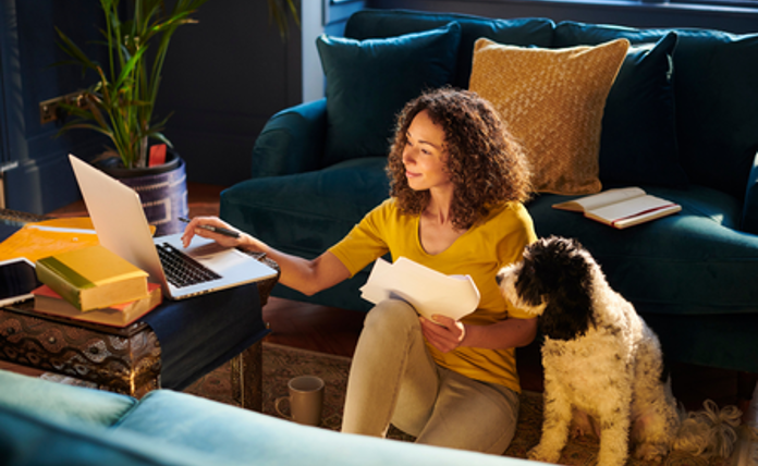 Lady On Laptop With Dog