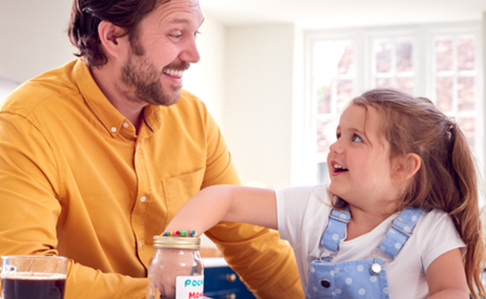 Dad and daughter counting pennies