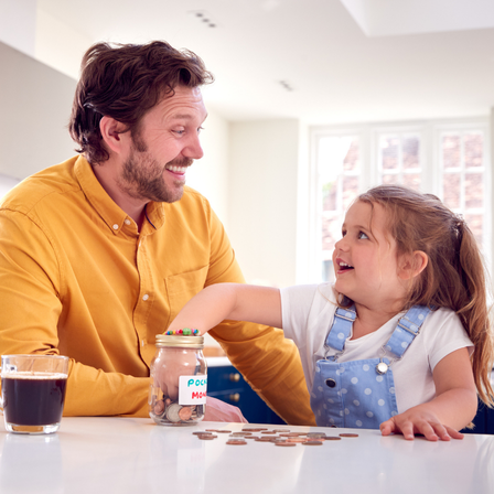 Dad and daughter counting pennies