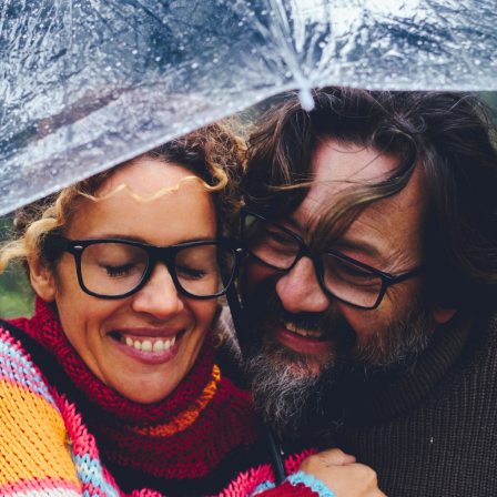 Couple Hugging Under Umbrella
