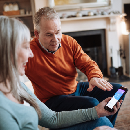 Older couple looking at phone